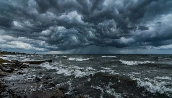 Stormy skies over Lake Michigan with dark rolling clouds and turbulent water