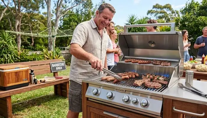 Outdoor Australian barbecue with food sizzling on a grill during a sunny gathering.
